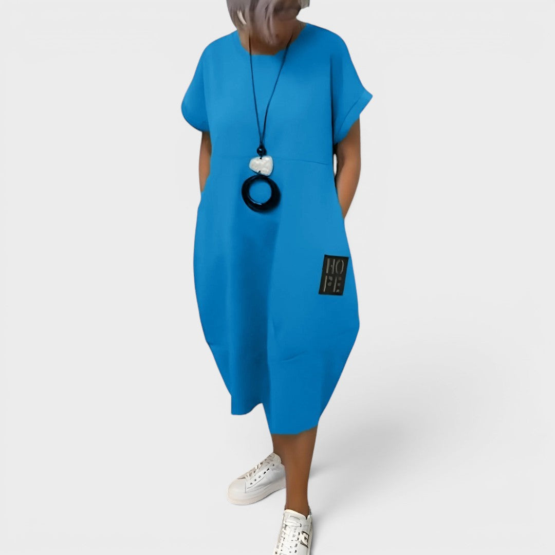 Nicole | Vestido midi fluido con bolsillos