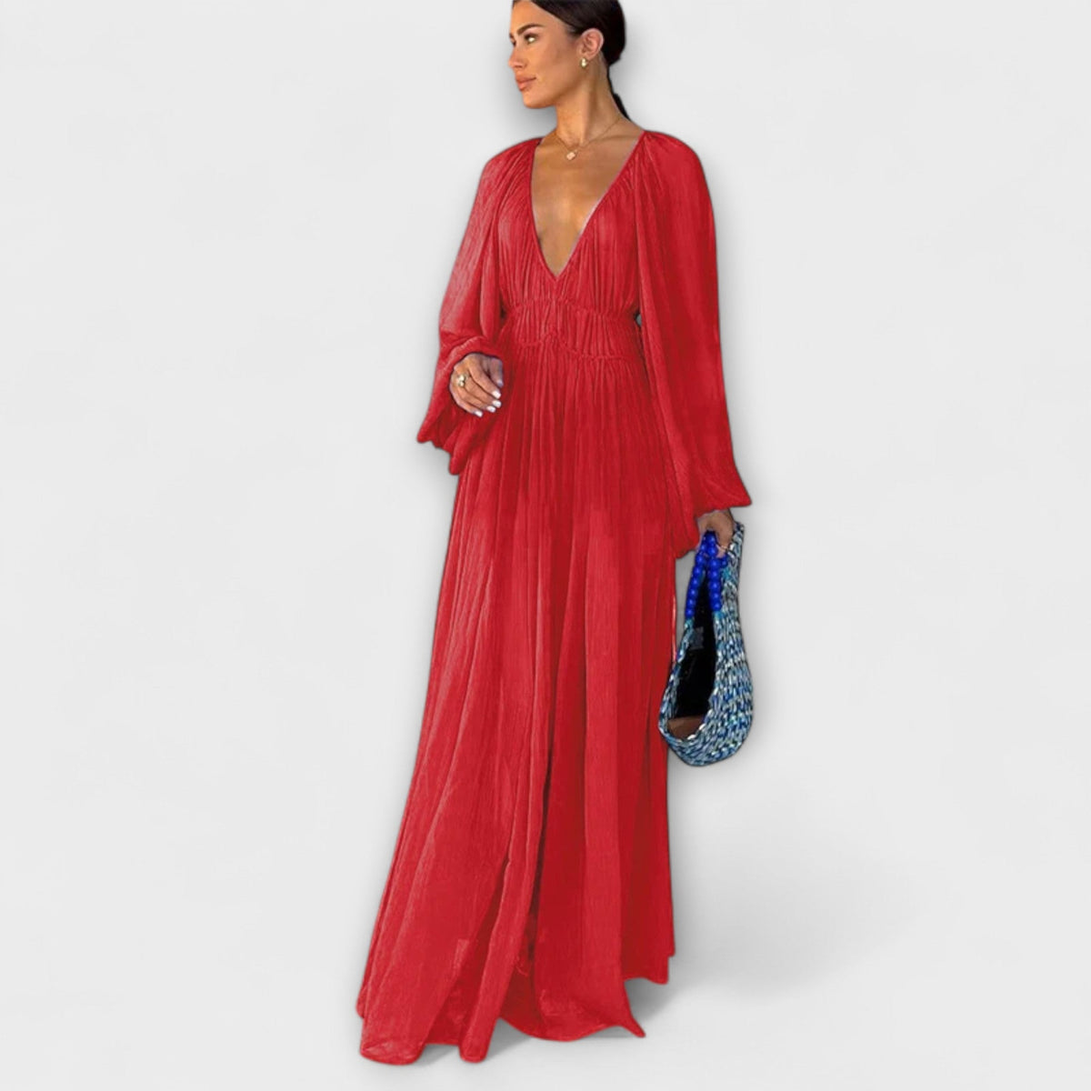 Túnica elegante plisada de manga larga
