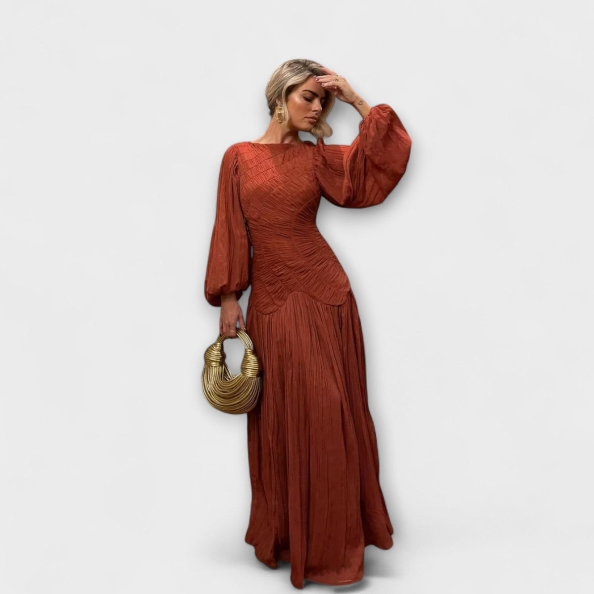 Túnica elegante plisada de manga larga