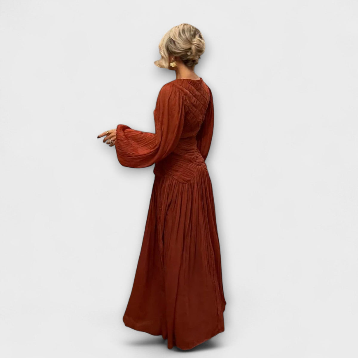 Túnica elegante plisada de manga larga